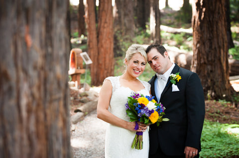 The wedding couple in the Redwood Grove flowers by Gorgeous and Green