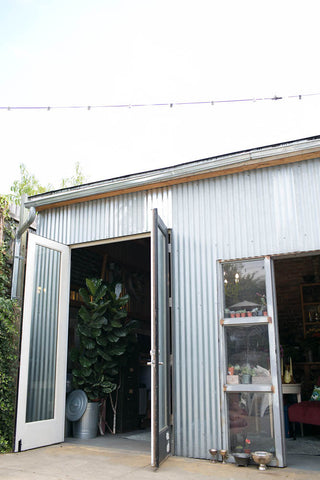 The currigated metal of the front of the G&G flower studio in Oakland