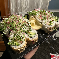 microgreens over sushi