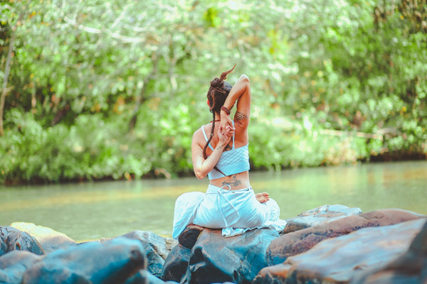 women doing yoga near water-bali spiritual retreat-mikkoa yoga
