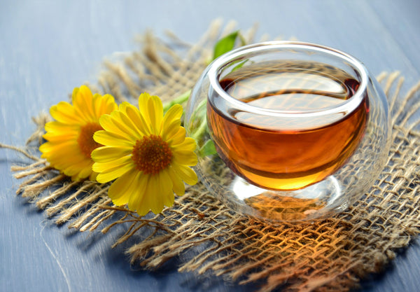 tea in cup with yellow flowers-yogi tea-mikkoa yoga