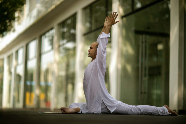 man wearing yoga clothes during yoga practice-travel checklist for next travel-mikkoa yoga