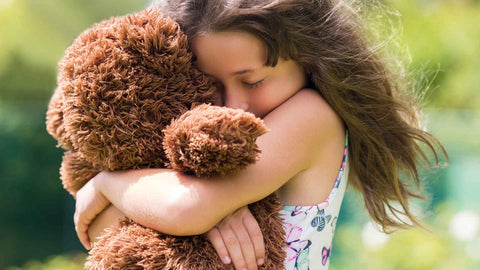 Cuddling Teddy Bear plush