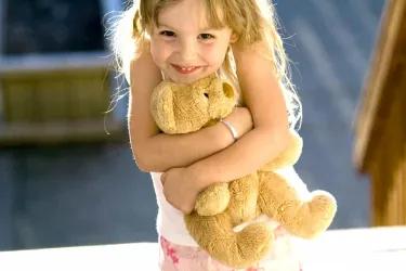 Girl holding a teddy bear