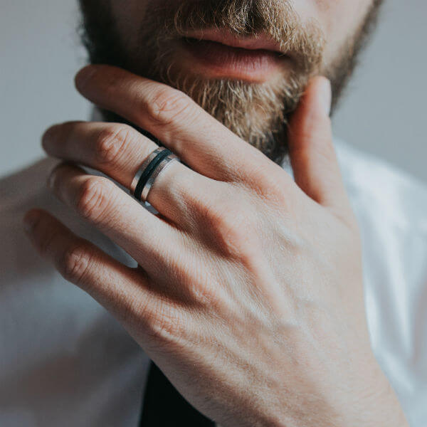 man with beard wearing engagement ring