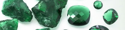 rough emerald and cut stones