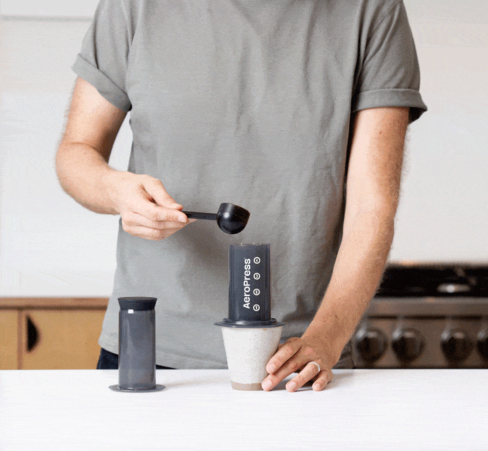 AeroPress Original Coffee and Espresso Maker short video how to prepare your coffee in easy steps, screw filter cap, add ground coffee and hot water, stir the brew, press coffee into a mug, and enjoy your smooth, rich, delicious coffee