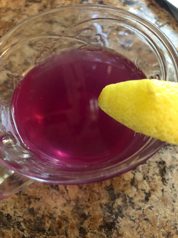 lemonade violet purple drink in tea cup for presentation