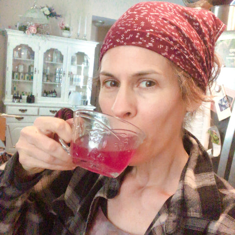 enjoying a vintage cup of sweet purple violet lemonade in vintage tea cup
