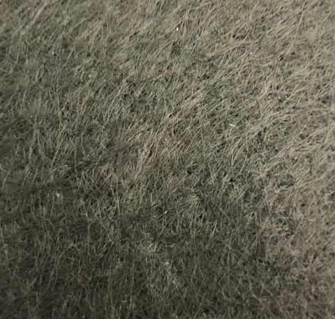 close up detail of fibers needle punched into a cloth and rolled to form non-woven geotextile