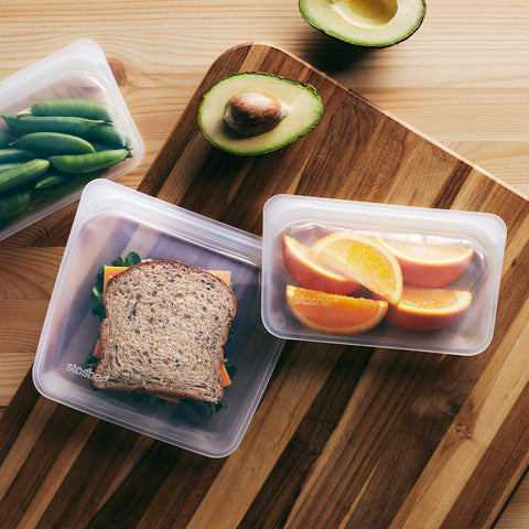 Two reusable bags with food in them