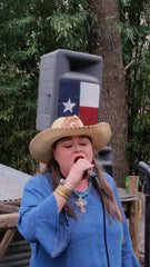 Stephanie singing at a wedding.