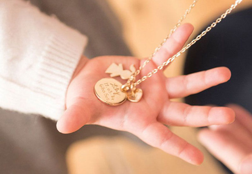 a personalized piece of jewelry as a birth gift