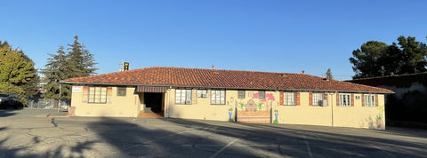 A picture of the outside of the building with lovely floral murals with a Spanish villa feel at Boulevard Circle in Walnut Creek CA.