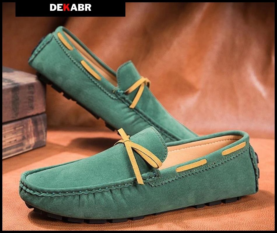 DEKABR green leather loafers for men with yellow laces on a brown backdrop