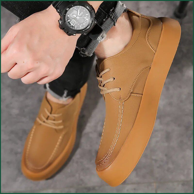 Tan Men’s Casual Shoes with laces, styled with black pants and a watch for a smart look