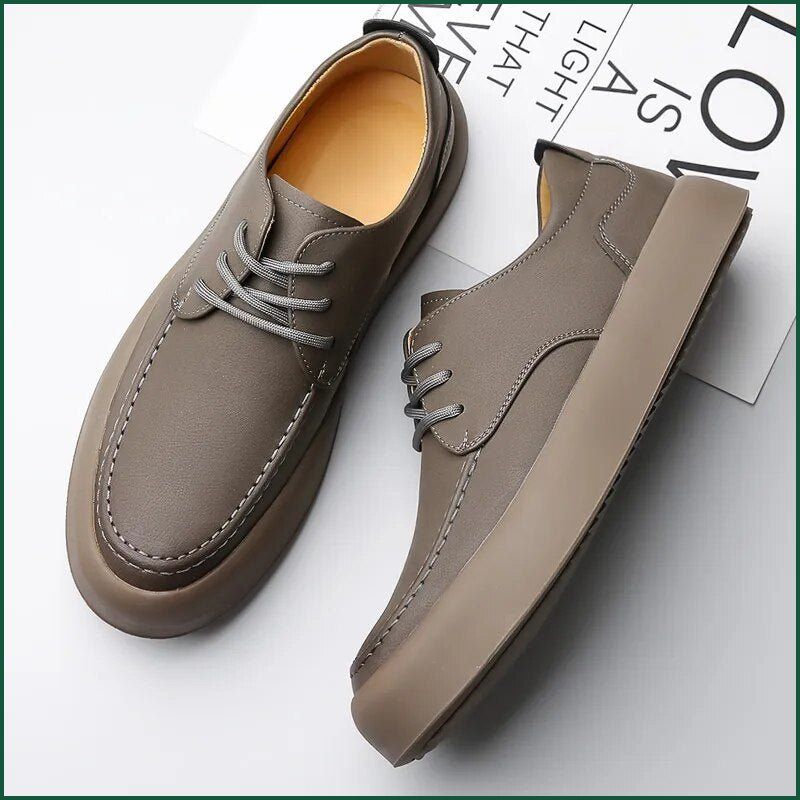 Taupe Men’s Casual Shoes with laces, displayed beside a magazine on a white surface