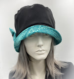 showerproof bucket hat in black with turquoise contrast front view