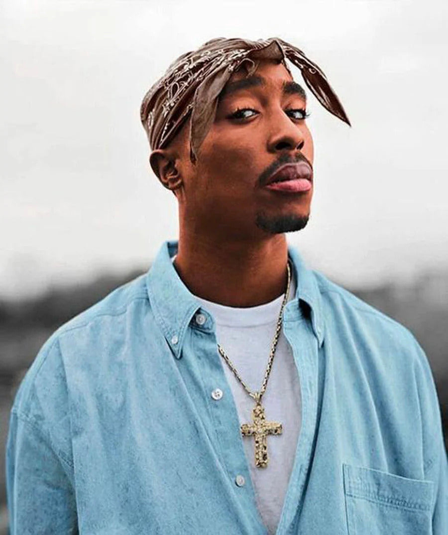 Close-up of Tupac Shakur with a backwards bandana, an icon of 90s street style