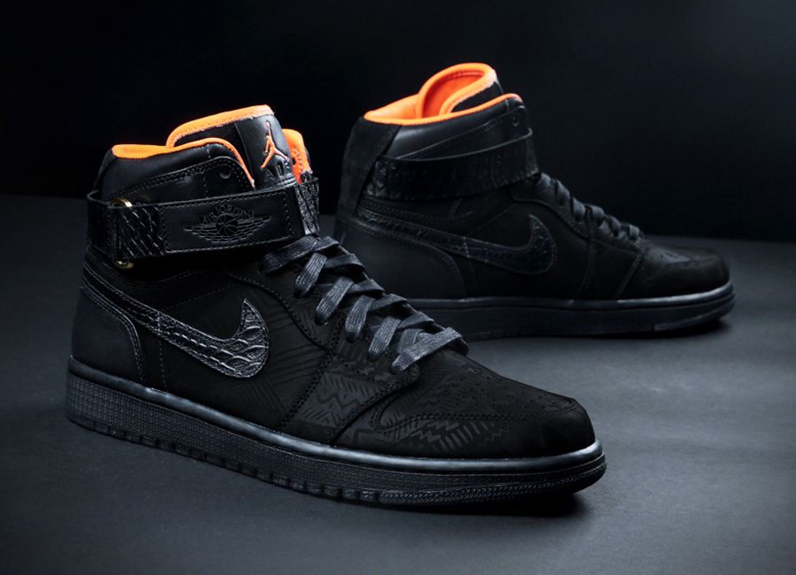 Pair of Air Jordan 1 x Don C "BHM" high-top sneakers in total black colorway with orange interior