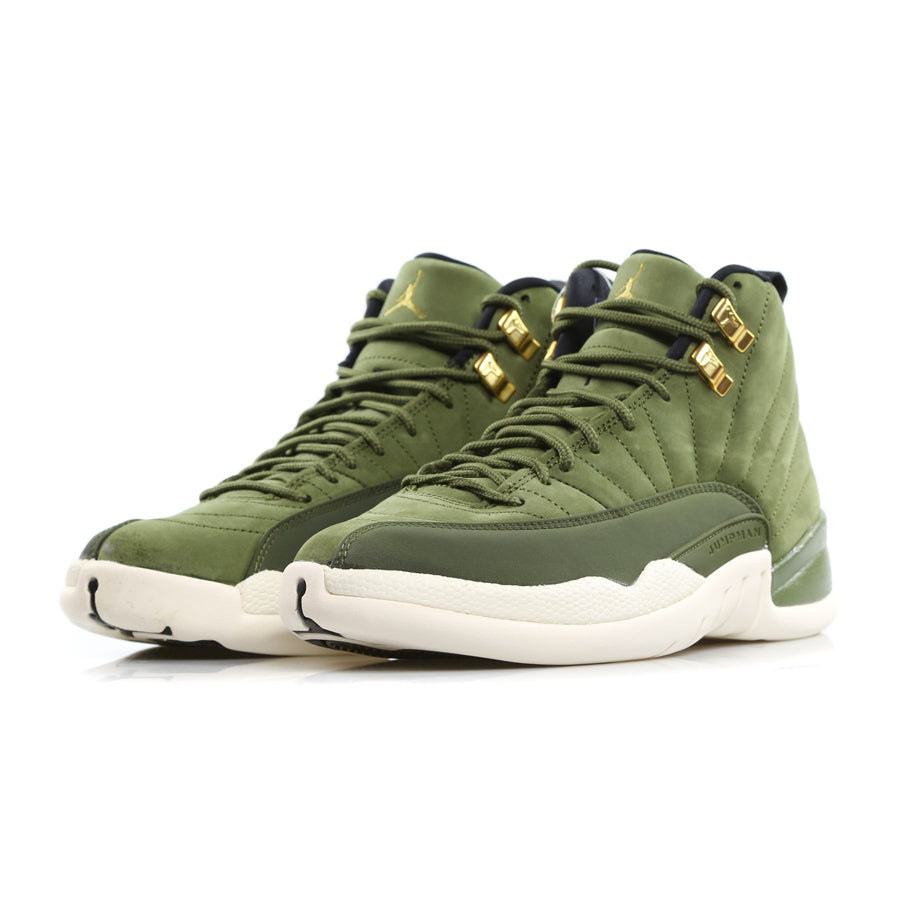 Pair of Air Jordan 12 Retro basketball sneakers in the green olive colorway with golden lace loops and Jordan logo
