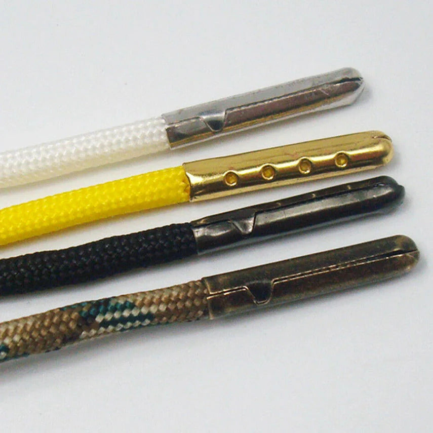 Four examples of lace "aglets", the tips that close the ends