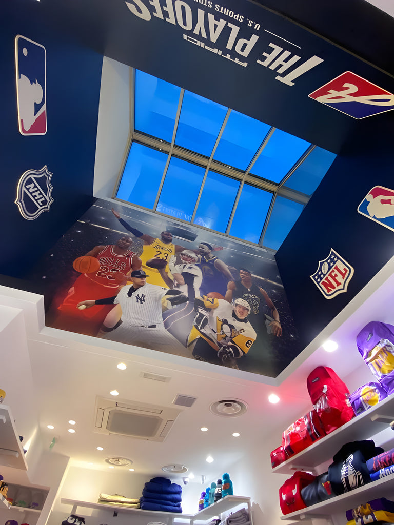 Ceiling with skylight of The Playoffs Corner, the space inside Atipici Shop Milano dedicated to fangear clothing and accessories from the US Sports NBA, NGL, MLB, NHL leagues