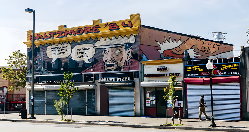 photo of the exterior of Cindarella Shop, the sneakers and streetwear shop in Baltimore (USA) with a cartoon-style street art mural on the top of the building that recalls "that time they saved the AF1"