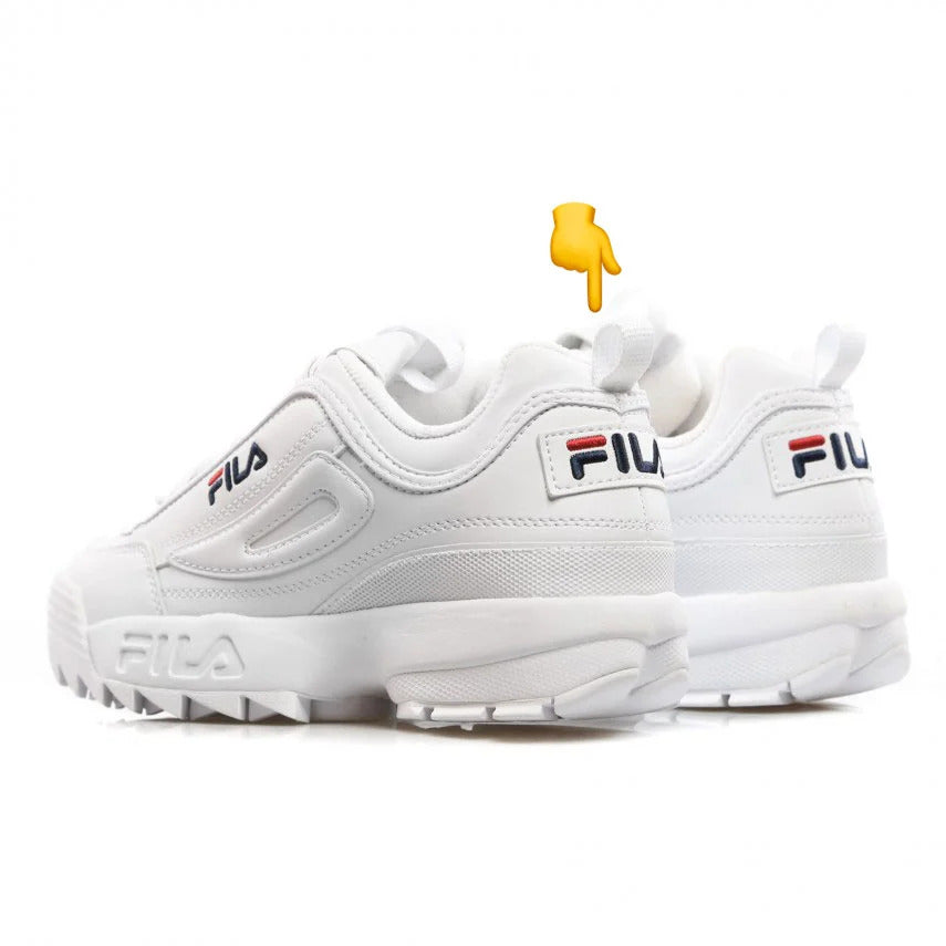 Pair of Fila Disruptor total white sneakers in white coloway with focus on the padded collar