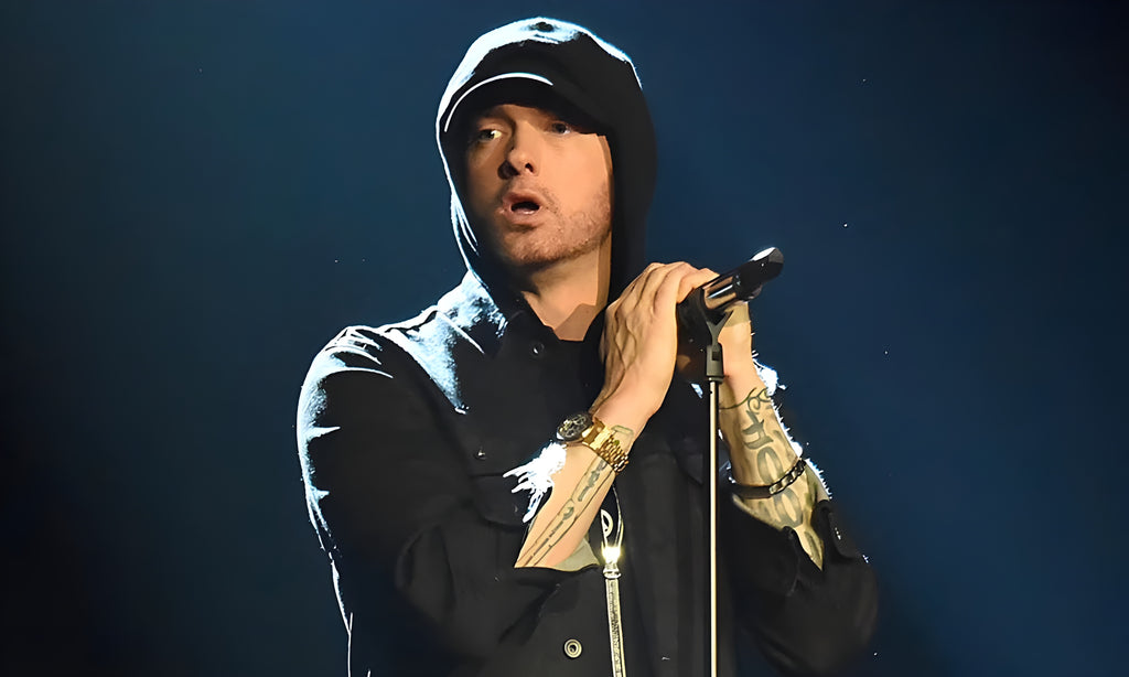 Eminem on stage with microphone in hand