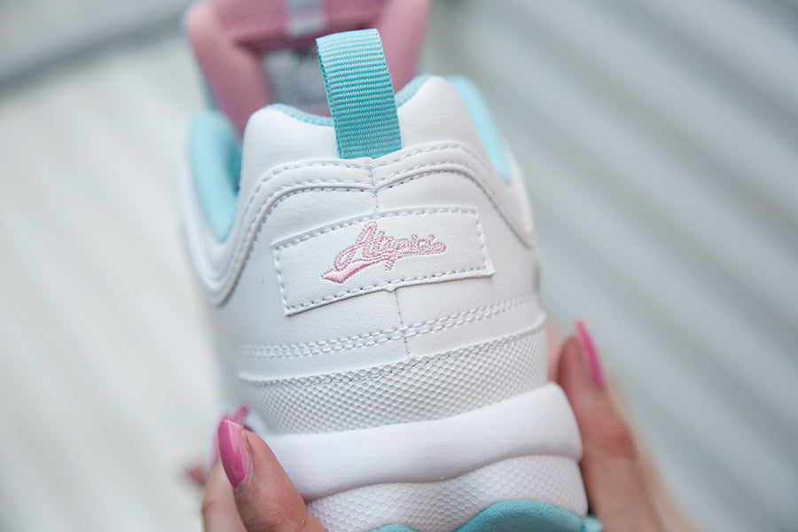 Atipici logo embroidered in pink thread on the heel of the Fila x Atipici Disruptor The Candy Shop sneaker