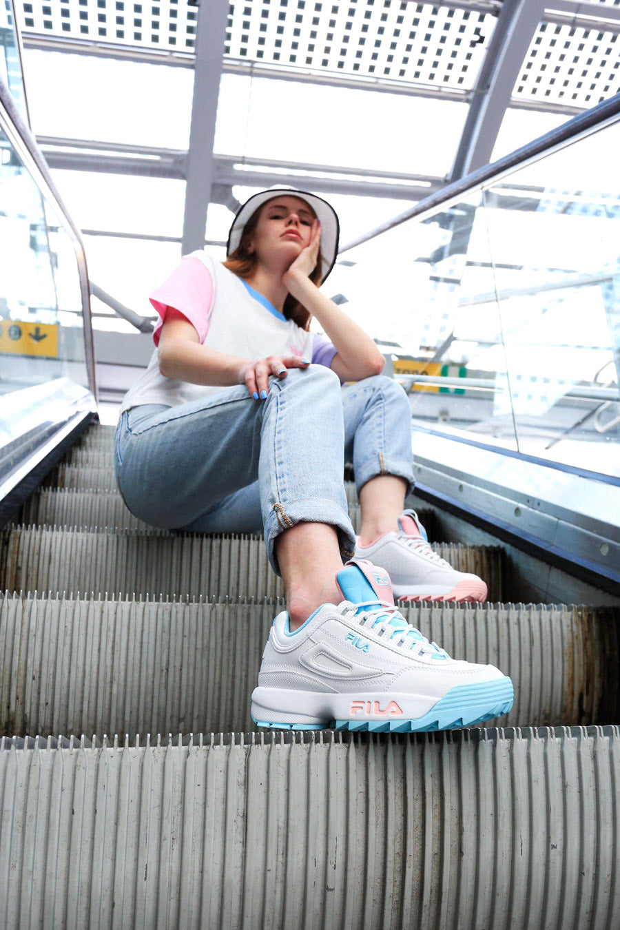 Shooting Disruptor Fila x Atipici The Candy Shop on an escalator