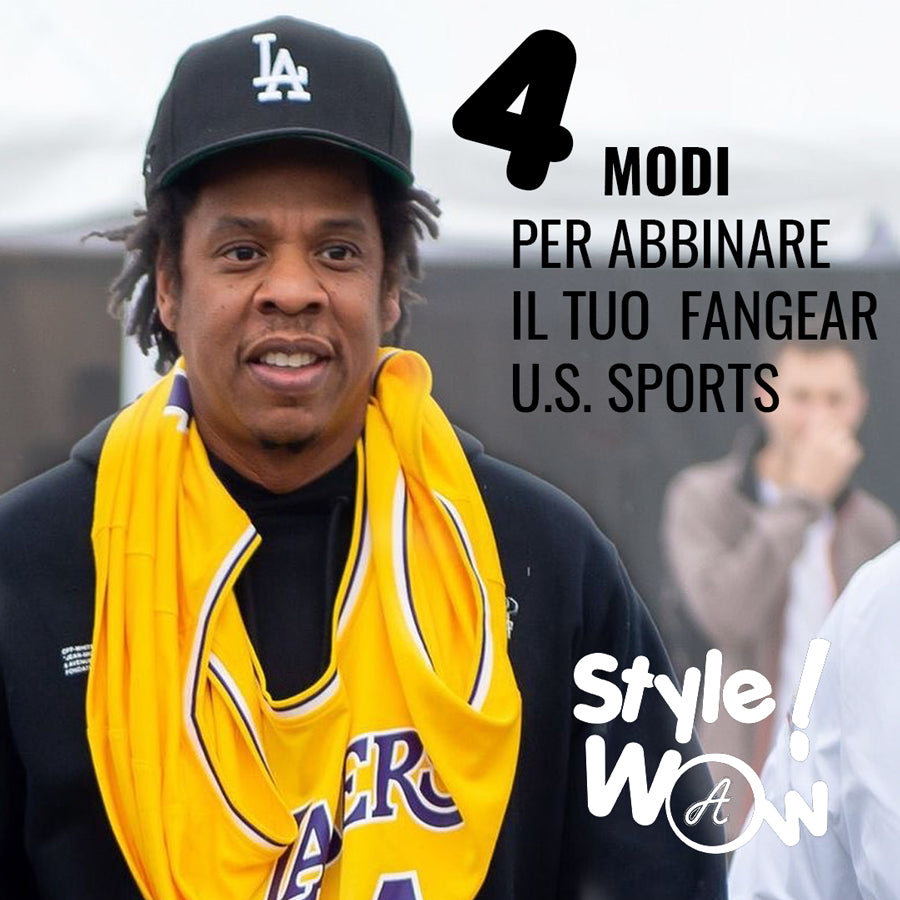 Jay-Z wears a Los Angeles Lakers NBA jersey tank top around his neck with a black curved visor MLB cap with the LA logo of the Los Angeles Dodgers