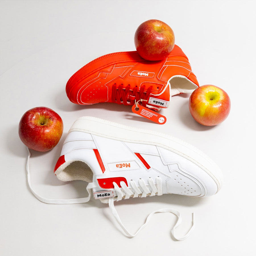 MoEa Gen 1 sneakers in the two colorways Apple white red and Apple full red, the two versions of plant based sneakers made with apple food production waste and other recycled materials