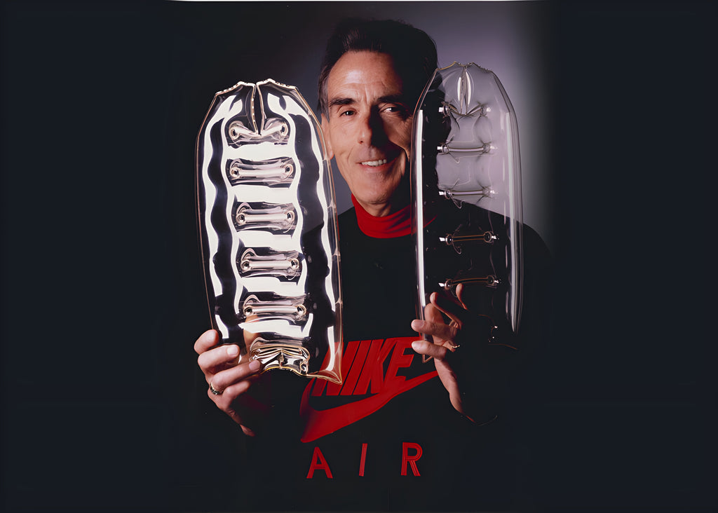 Marion Franklin Rudy, aerospace engineer and inventor of the Air Unit, holding two prototypes of the inner tube later inserted into the Air Max
