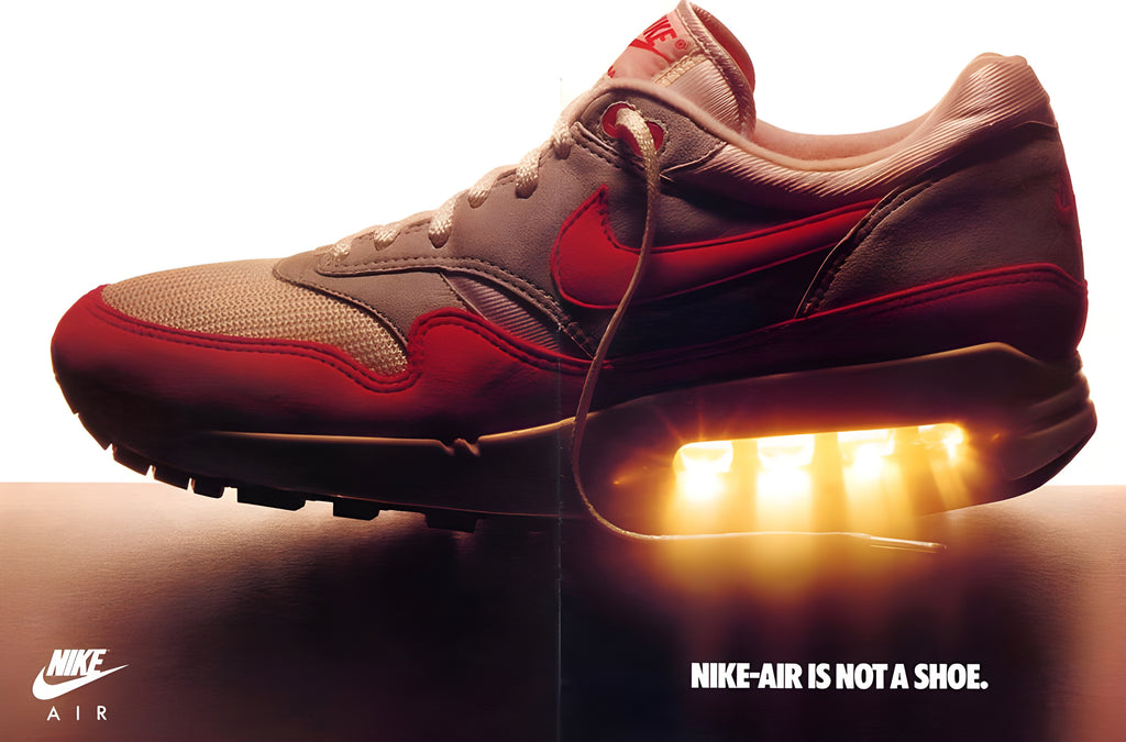 Original advertising sneaker of the first Air Max 1 in the white and red color with light passing through the visible Air Unity of the heel