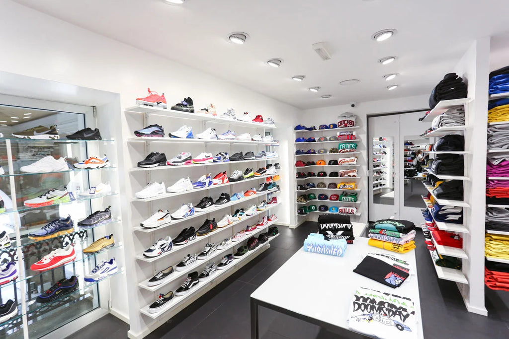 Sneakers wall with running and skate sneakers from top brands displayed inside the Atipici Shop Cuneo streetwear clothing store in Corso Nizza 4, currently closed