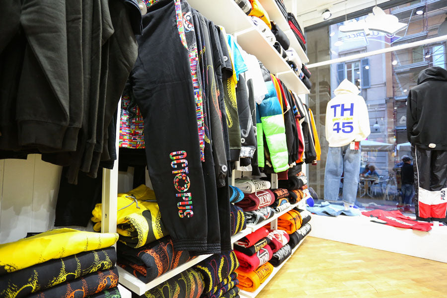 selection of streetwear clothing for men, women and children from top international and Italian brands such as Octopus, Iuter and Dolly Noire displayed within Atipici Shop Novara