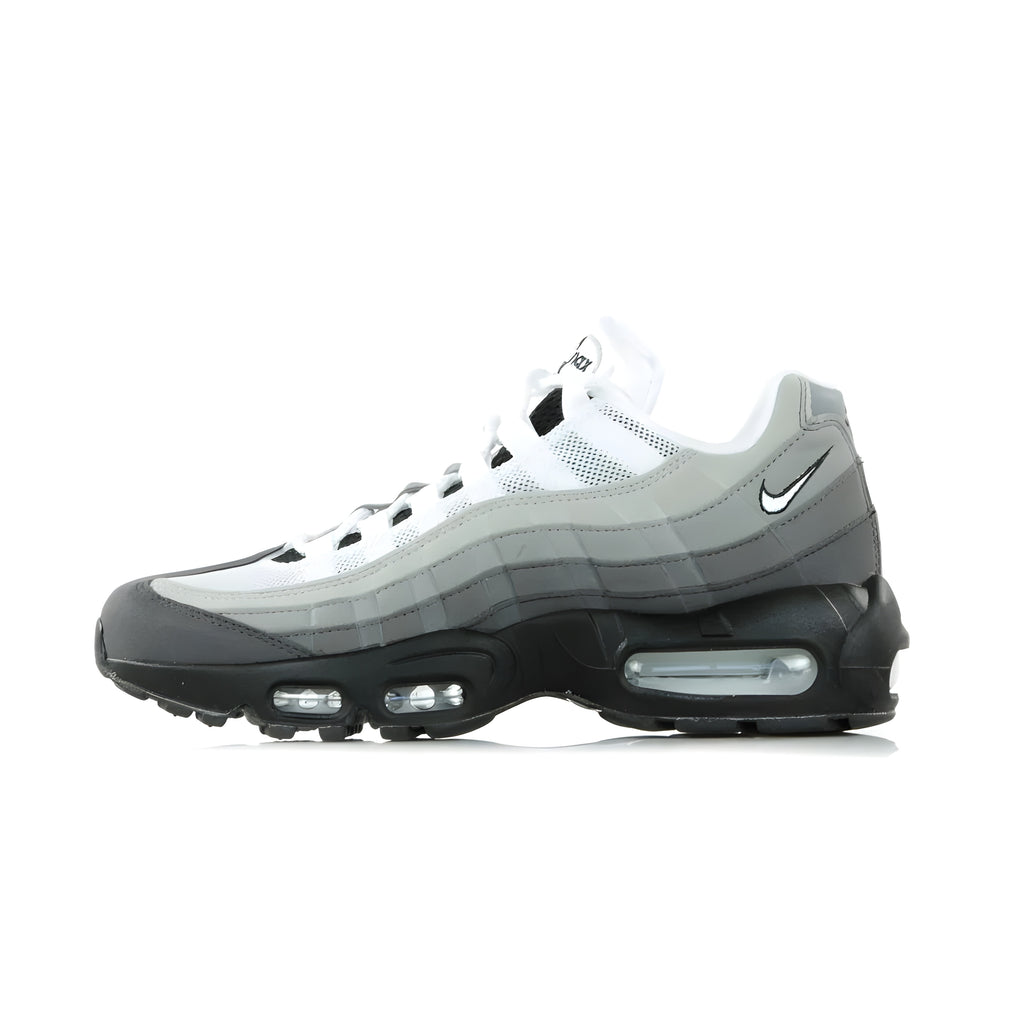 Nike Air Max 95, Italian design inspired by the states of the earth with upper with horizontal bands and colorway in shades of cold grey. It is the first Nike sneaker to feature a sole with two visible Air Units, one for the heel and one for the forefoot