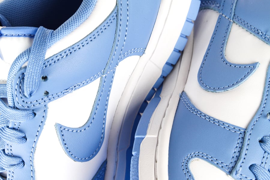 Detail of the Nike Dunk Low UNC low sneakers in the white/light blue "University Blue" colorway in honor of the colors of the University of North Carolina