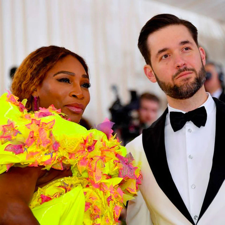 Serena Williams in a floral coat and her ex-husband in a tuxedo at a gala evening