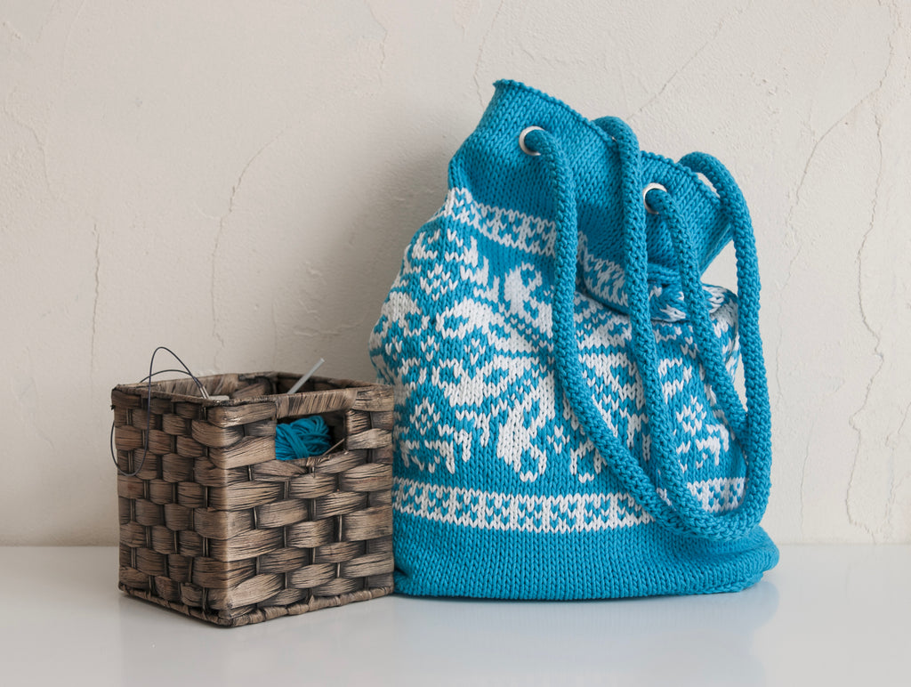 Turquoise hand-knitted handbag in nordic pattern