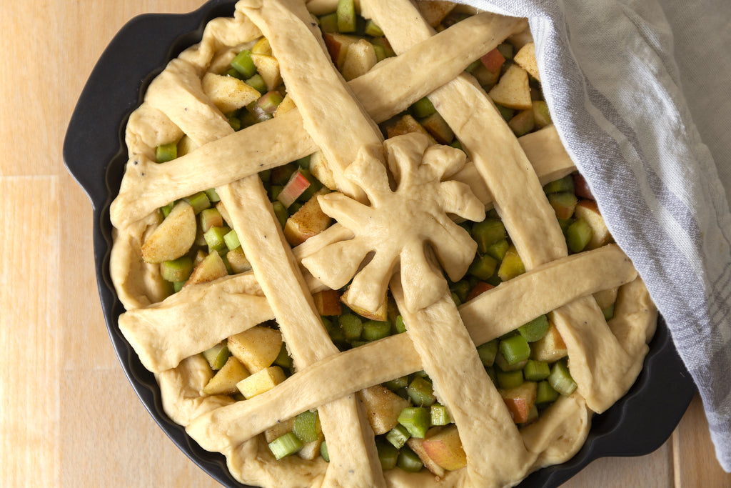 Rhubarb and apple pie in a form ready to bake