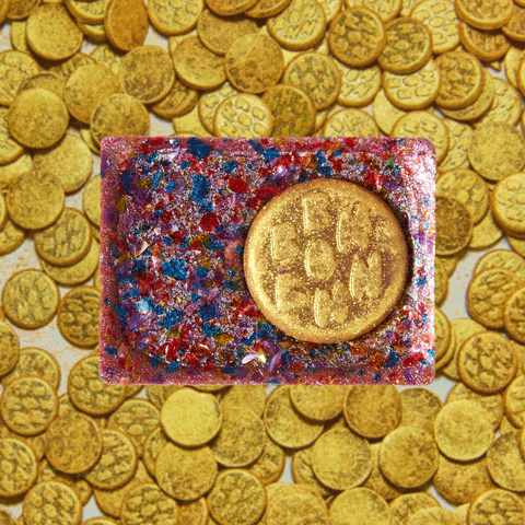 gif of different views of the bon of the month, pot o gold on a background of gold coins
