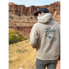 Model wearing Desert Drifter hoodie in a desert landscape