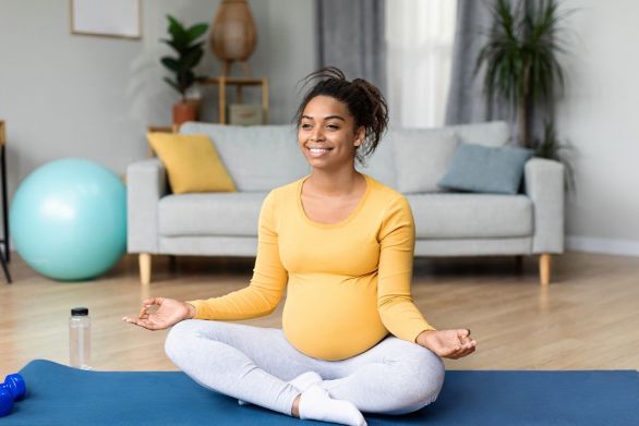 11. Pregnant woman sat in yoga position