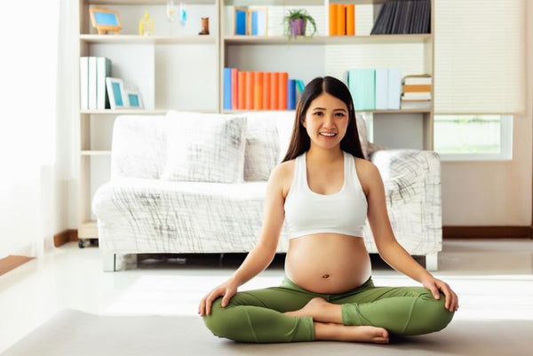 11. pregnant woman sitting in yoga position