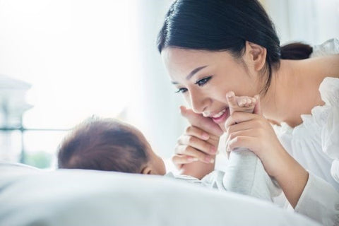 loving mother gazing at baby