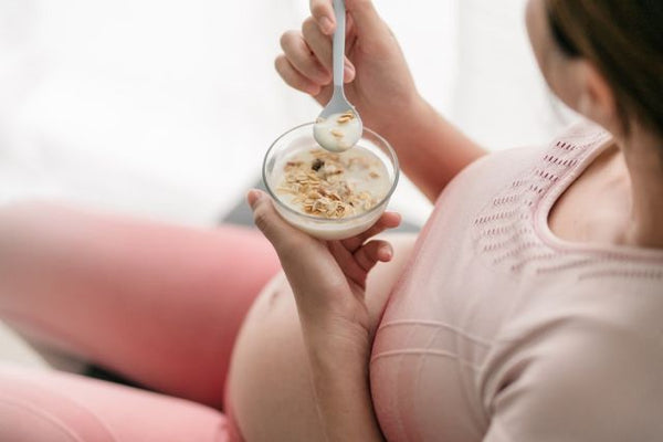 3. Mum-to-be eating healthy cereal