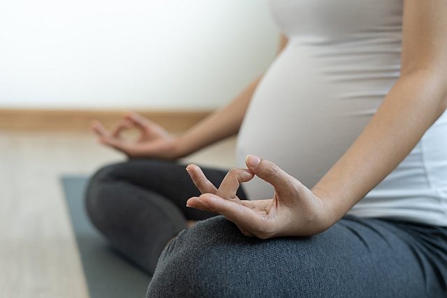 3. Pregnant Mum to be practicing self care yoga